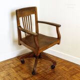 Oak wood office chair with swivel seat and swivel wheels