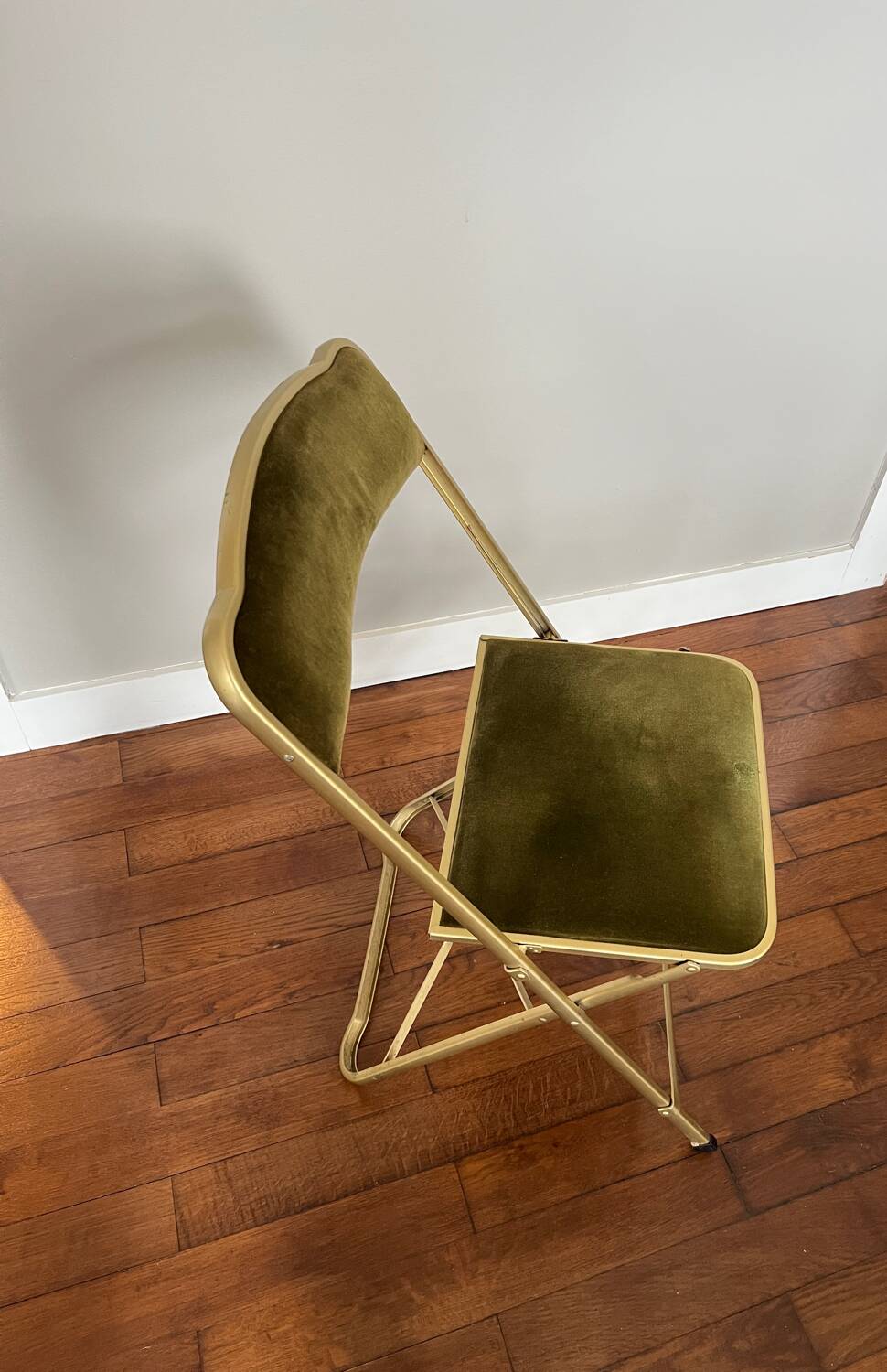Green velvet folding chair