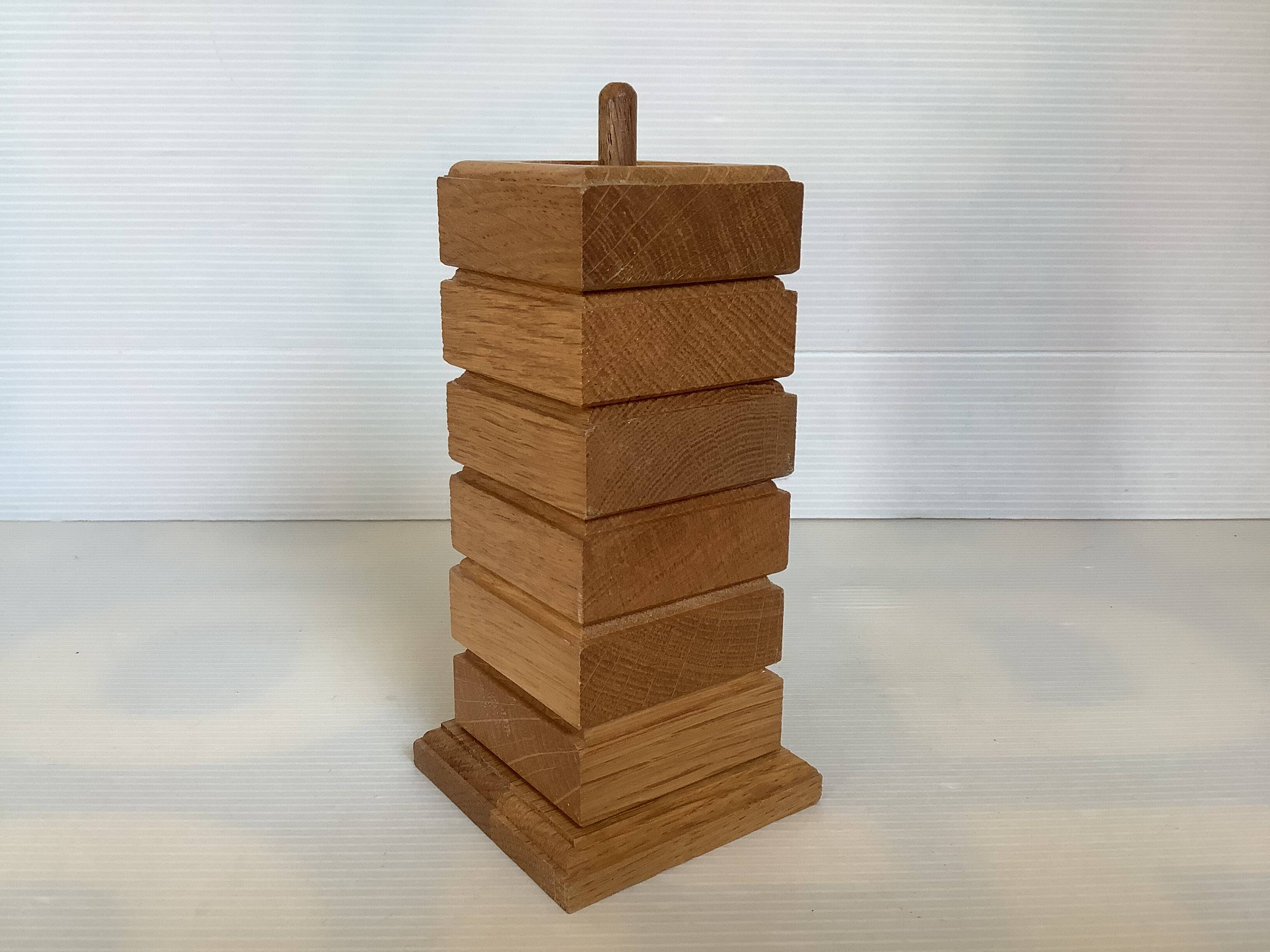 Six wooden egg cups and their Scandinavian style support