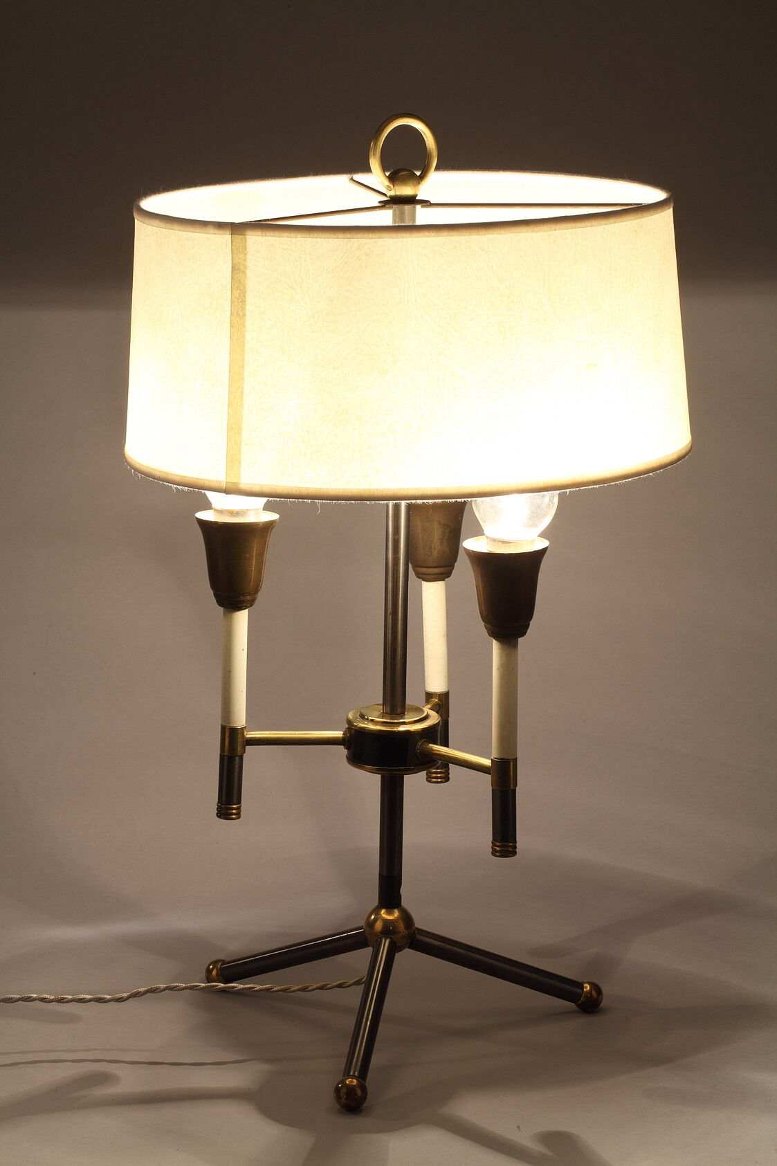Modernist table lamp in black and gold lacquered metal