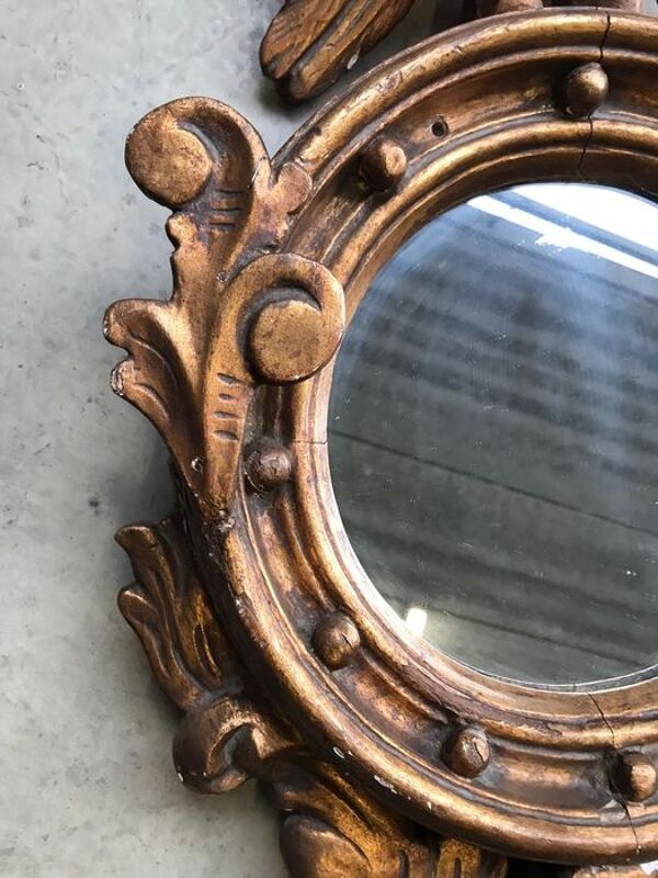 Miroir en bois doré Empire à décor d’aigle 40x97cm
