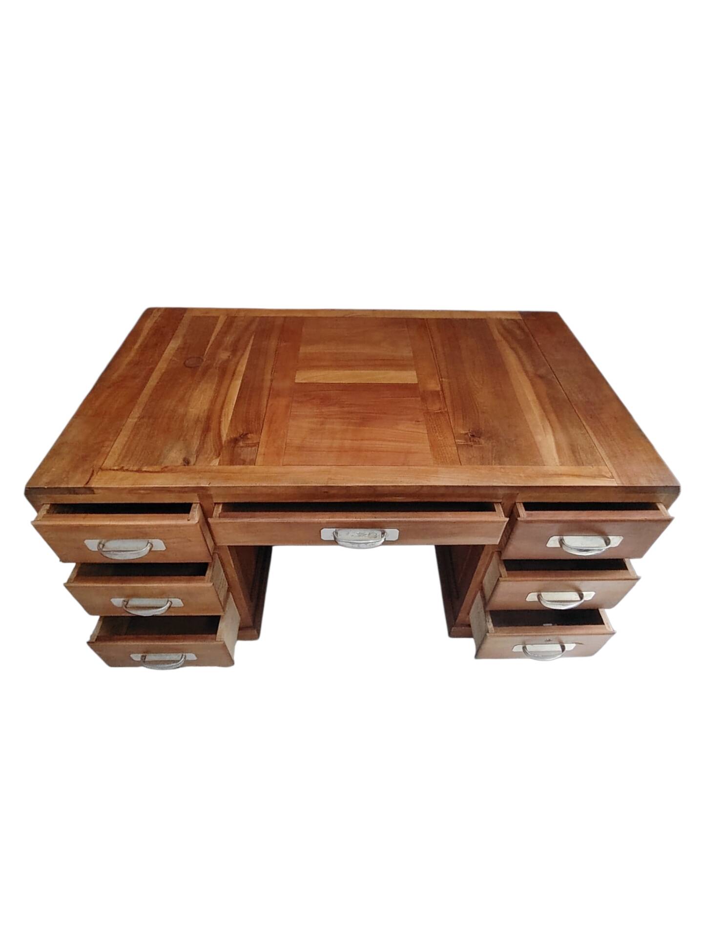 Large modernist minister's desk in solid lemon wood with 7 drawers.