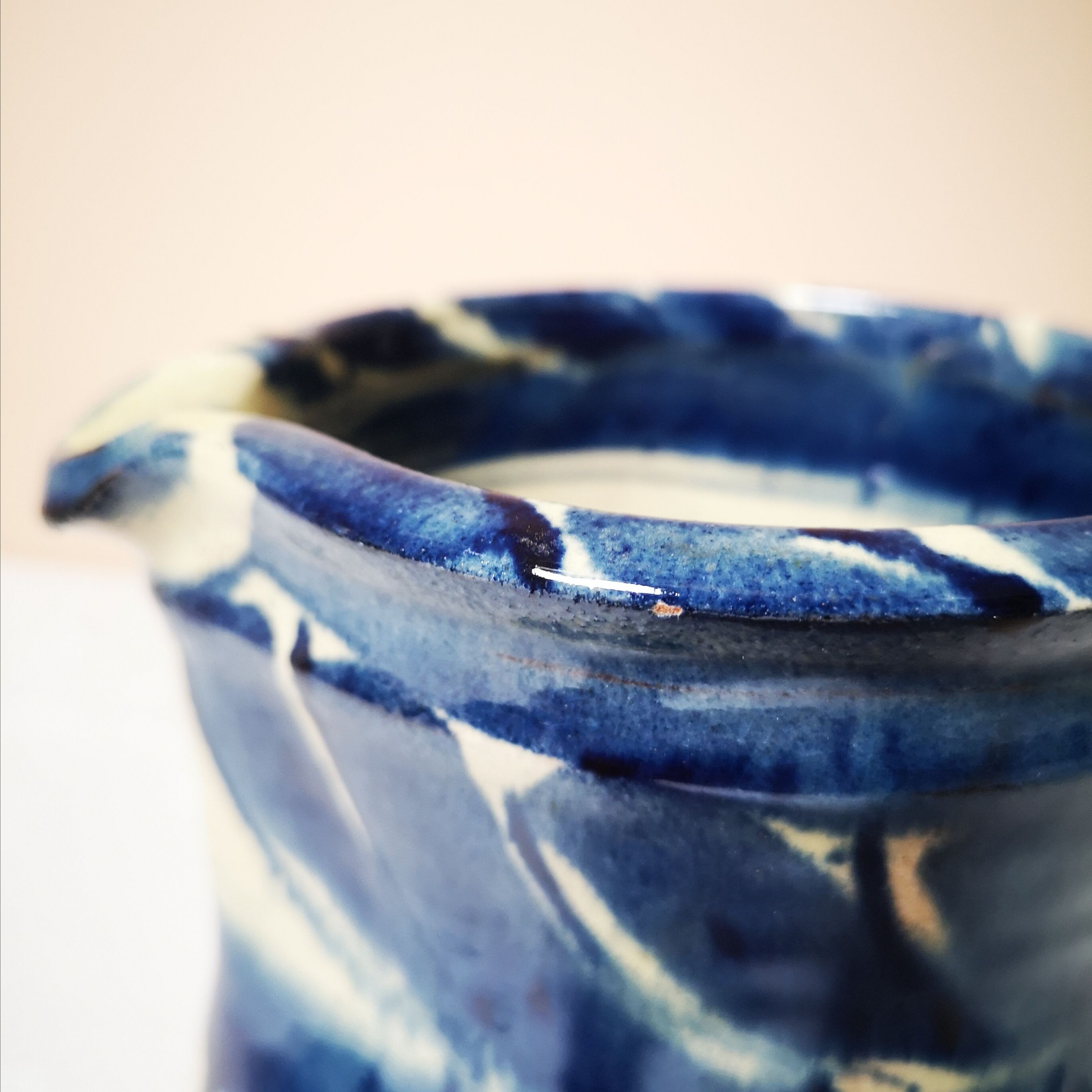 Enamelled ceramic blue pitcher signed by the artist