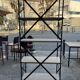 Industrial-style shelf in light wood and cast iron
