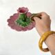 Antique slip candlestick depicting a flower