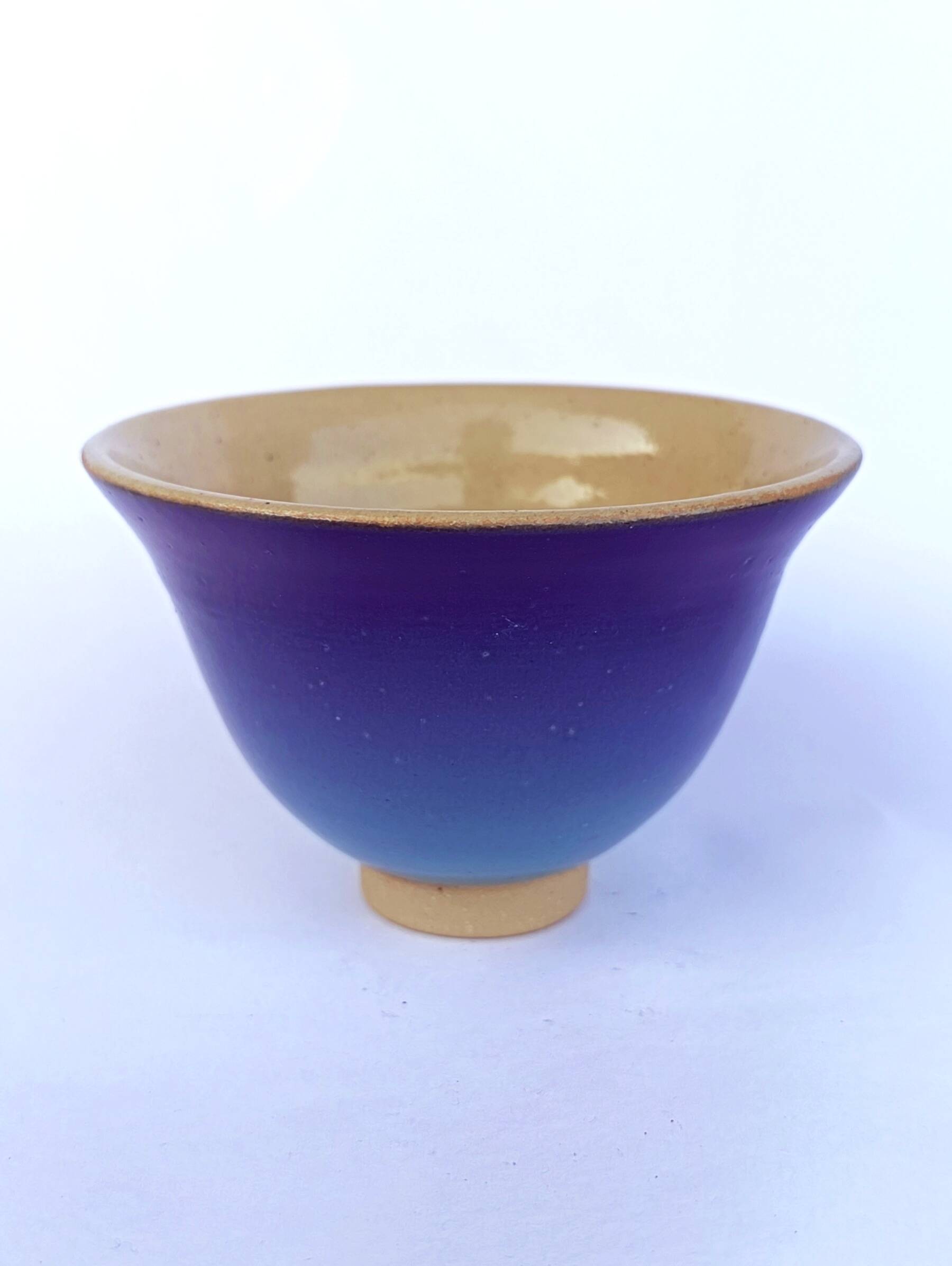 Blue glazed stoneware bowl on a foot, signed SP, Puisaye.