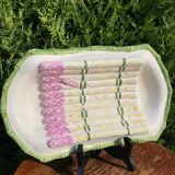 Plate of asparagus with a sauce.