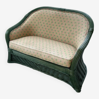 Green wicker bench and floral pattern