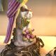 Pair of porcelain candlesticks with parrots and bronze mounts.