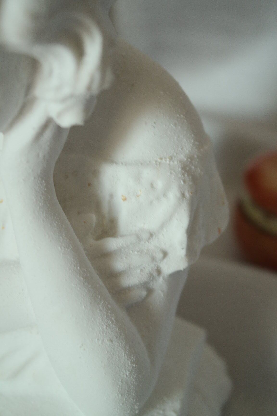 Limestone bust young girl who reads
