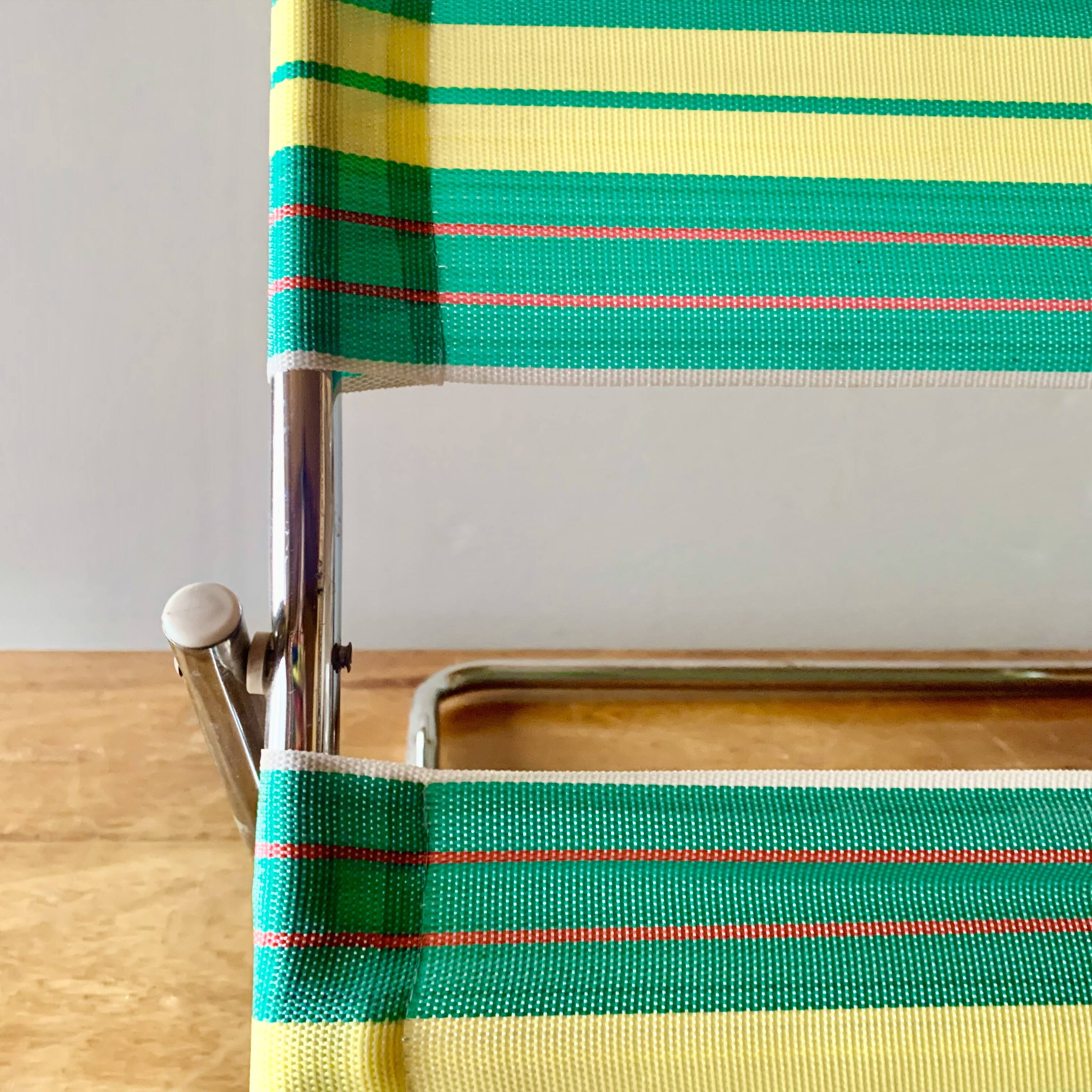 Vintage folding beach chair in chrome metal and woven plastic