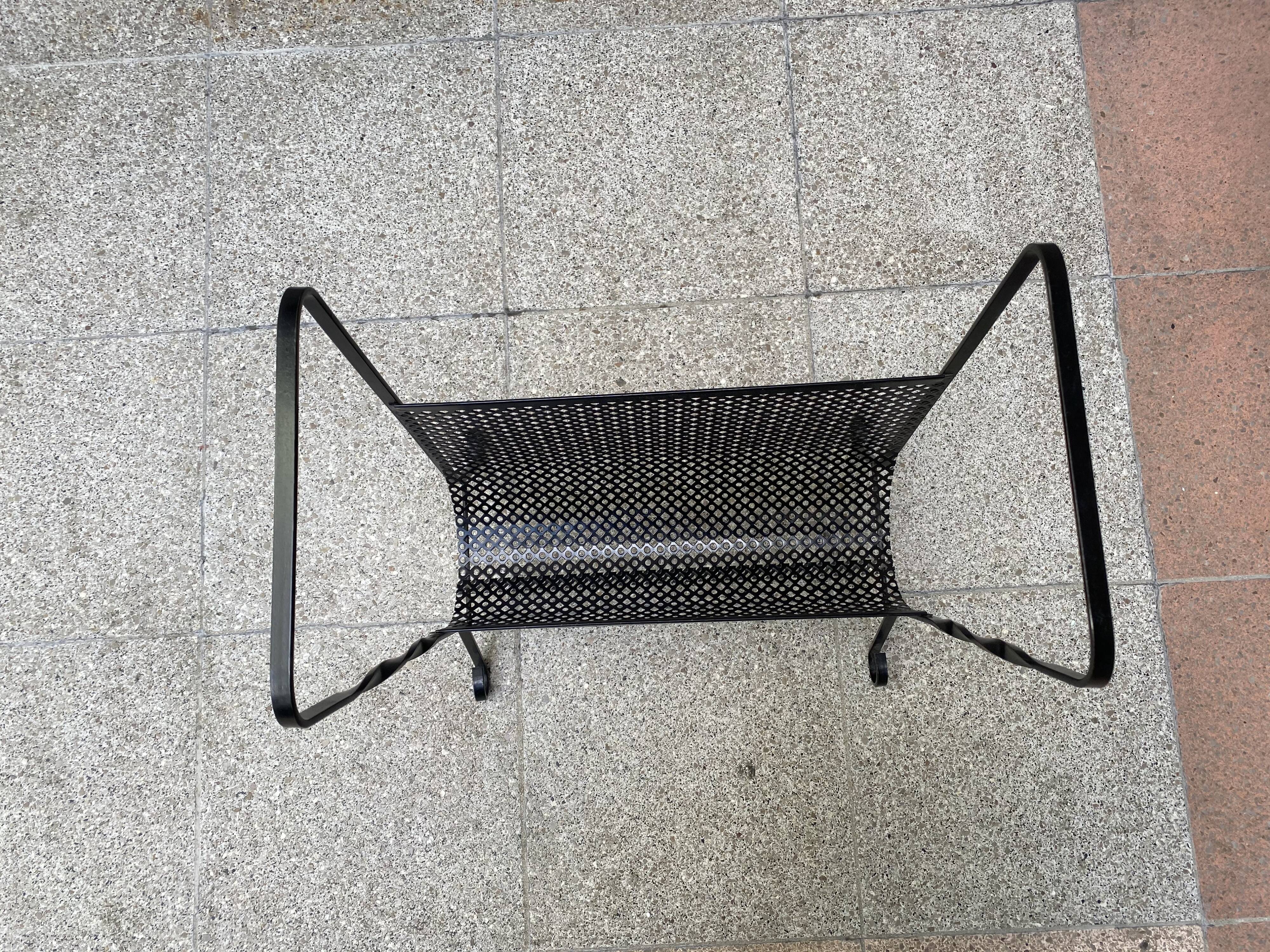 Perforated metal magazine holders - 1975