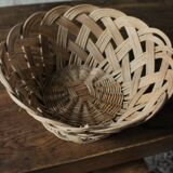 Large vintage twisted wicker basket on a stand