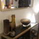 Console set and its mirror, black and gold, 80s