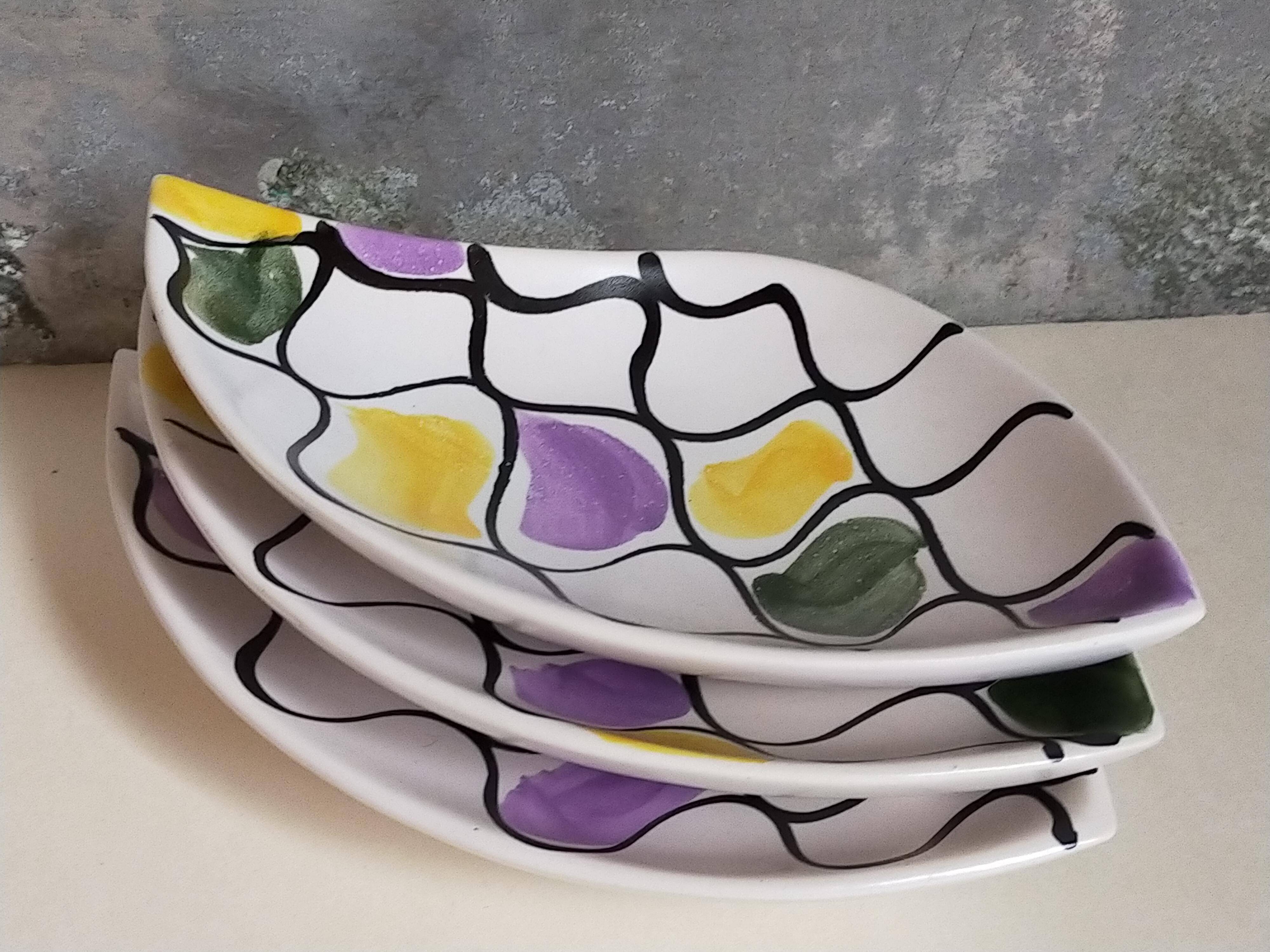 Three vintage free-form ceramic ravine dishes from the 1950s