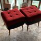 Set of 2 mid-century stools in red and black fabric and faux leather, with light wood legs.