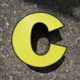 Letter C of yellow and black industrial sign