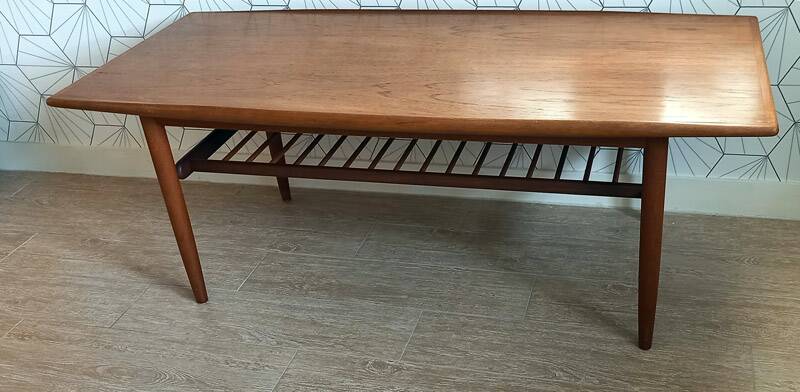 Danish 1960s teak coffee table with slatted shelf.