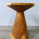 Minimalist side table in solid suar wood with conical legs.
