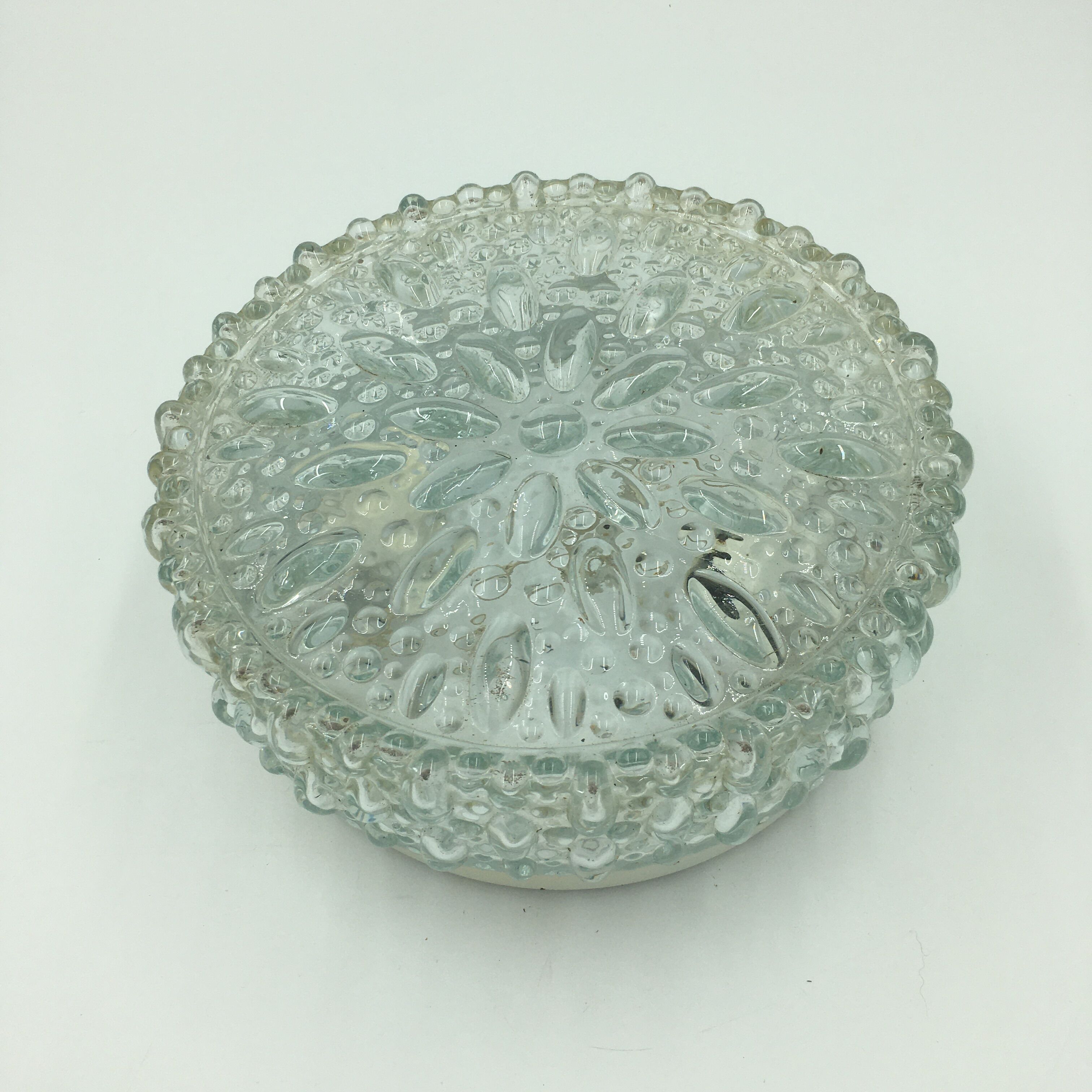 Round ceiling lamp in molded glass with relief