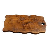 Rectangular solid teak board with wavy edges, perforated 37x17.