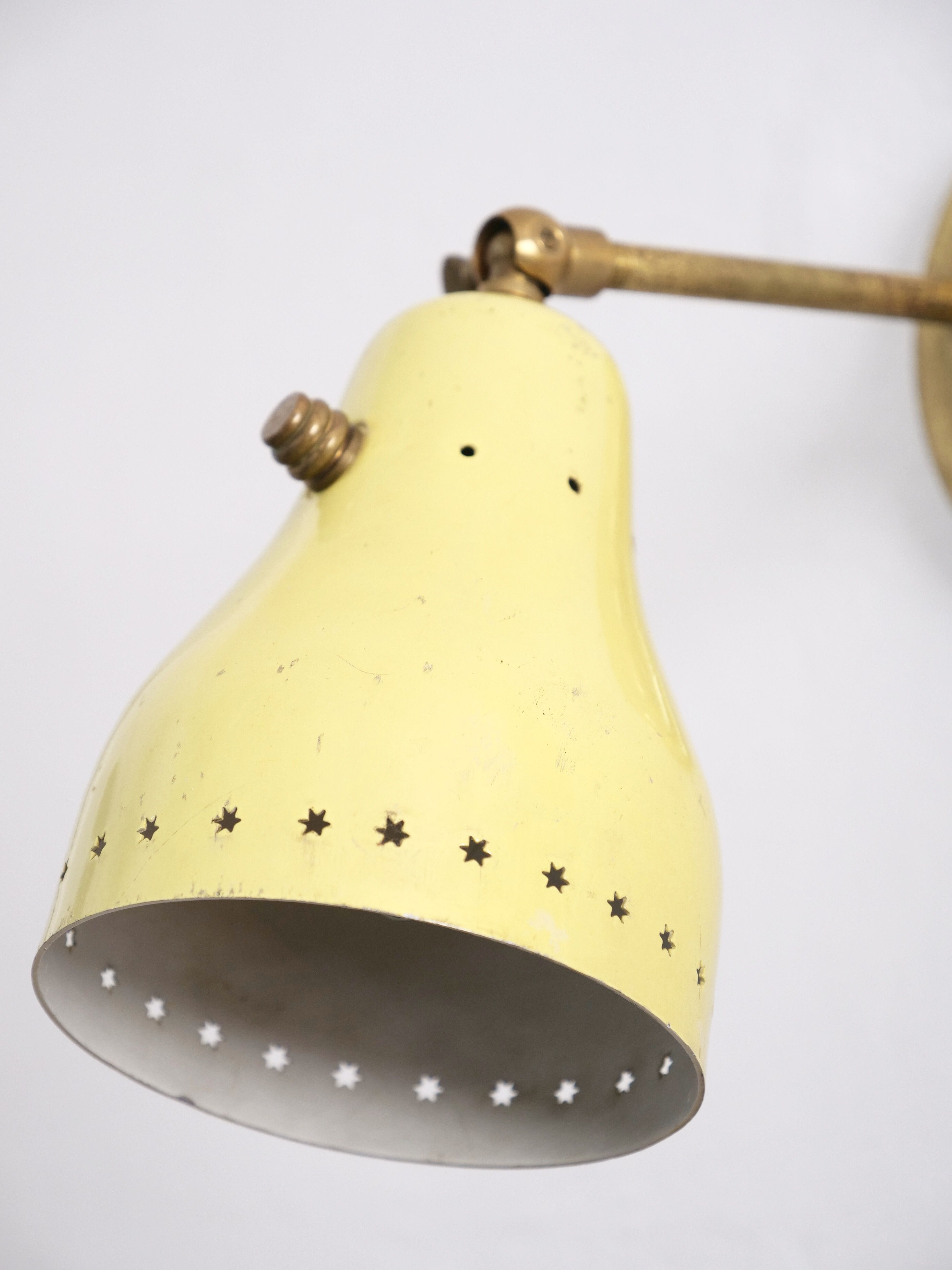 Wall lamp inlaiton and pale yellow lacquered metal