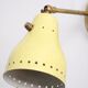 Wall lamp inlaiton and pale yellow lacquered metal