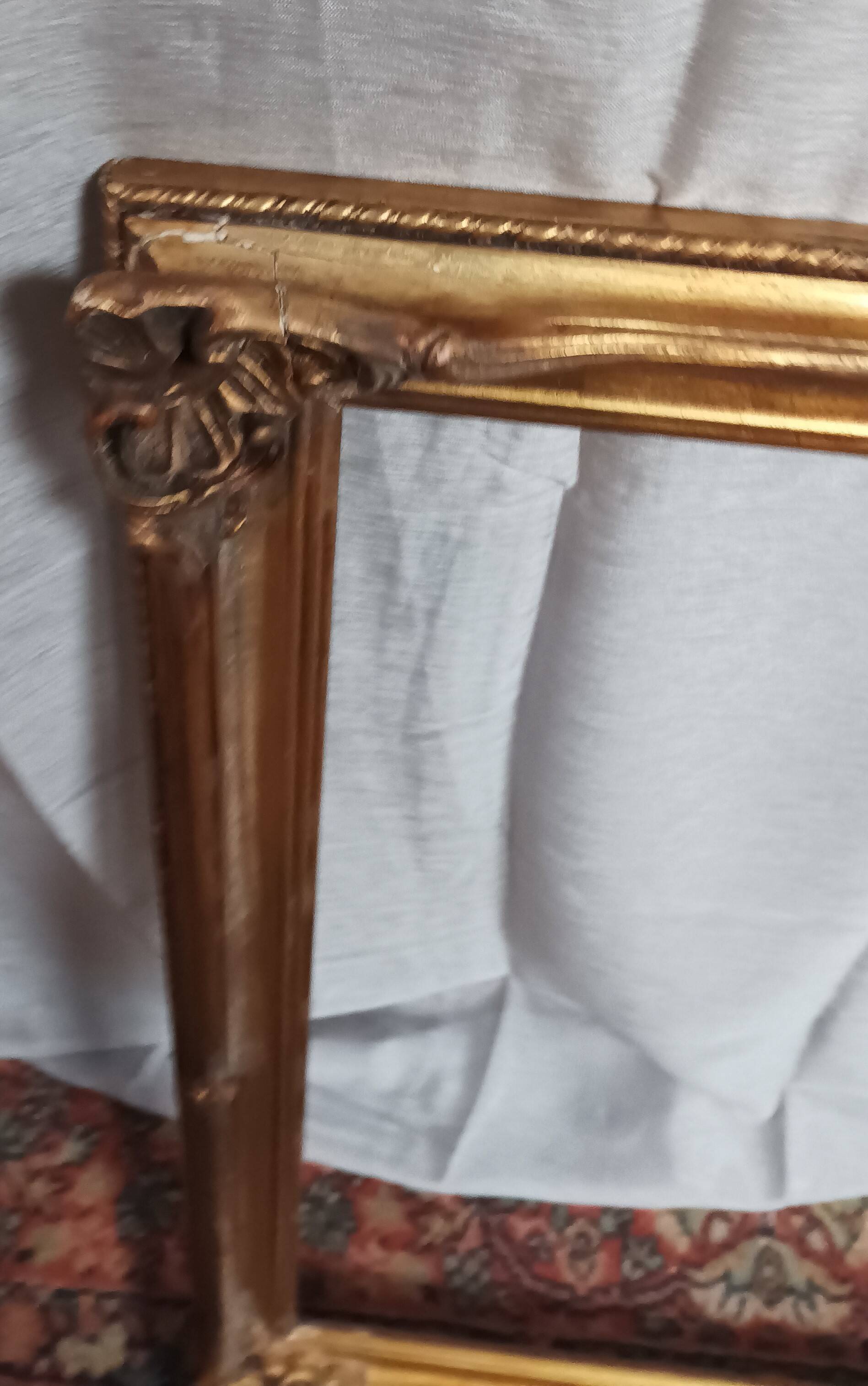 Old frame in wood and gilded stucco