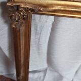 Old frame in wood and gilded stucco