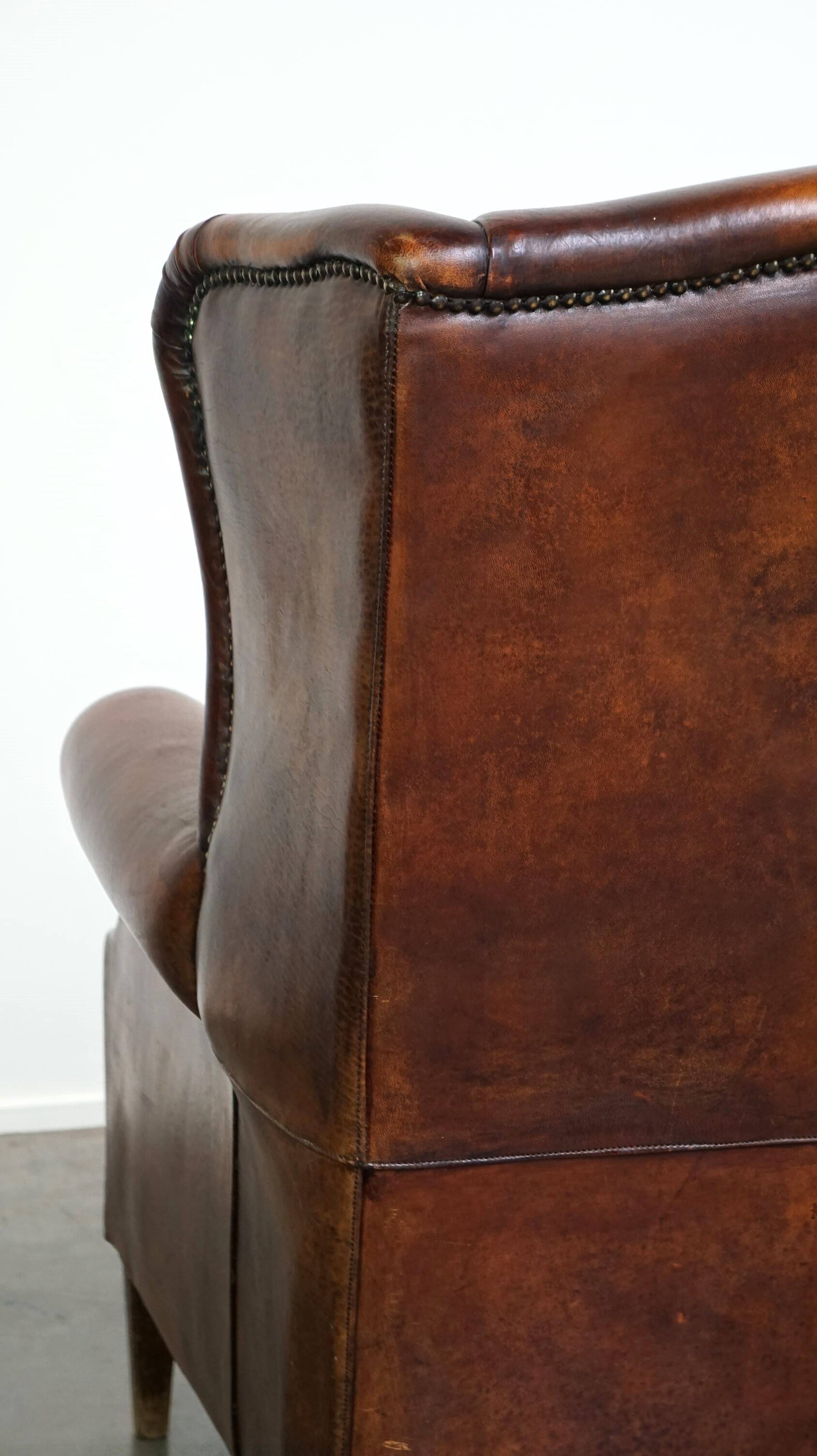 Large sheepskin wing chair with excellent colour and great seating comfort