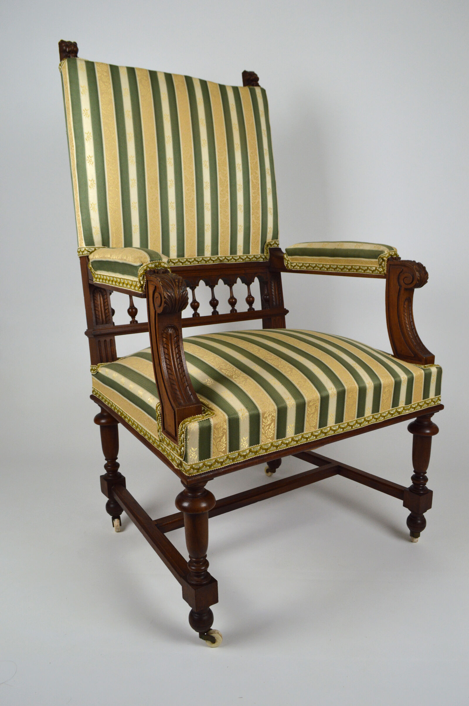 Neo-Renaissance walnut armchair with lion heads, circa 1880