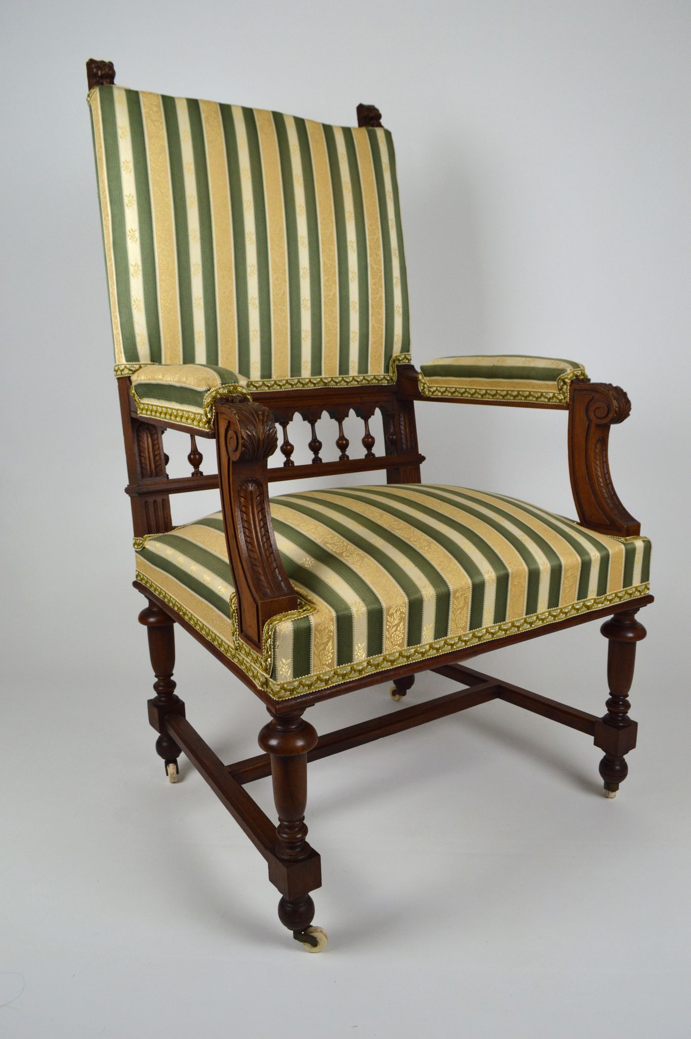 Neo-Renaissance walnut armchair with lion heads, circa 1880