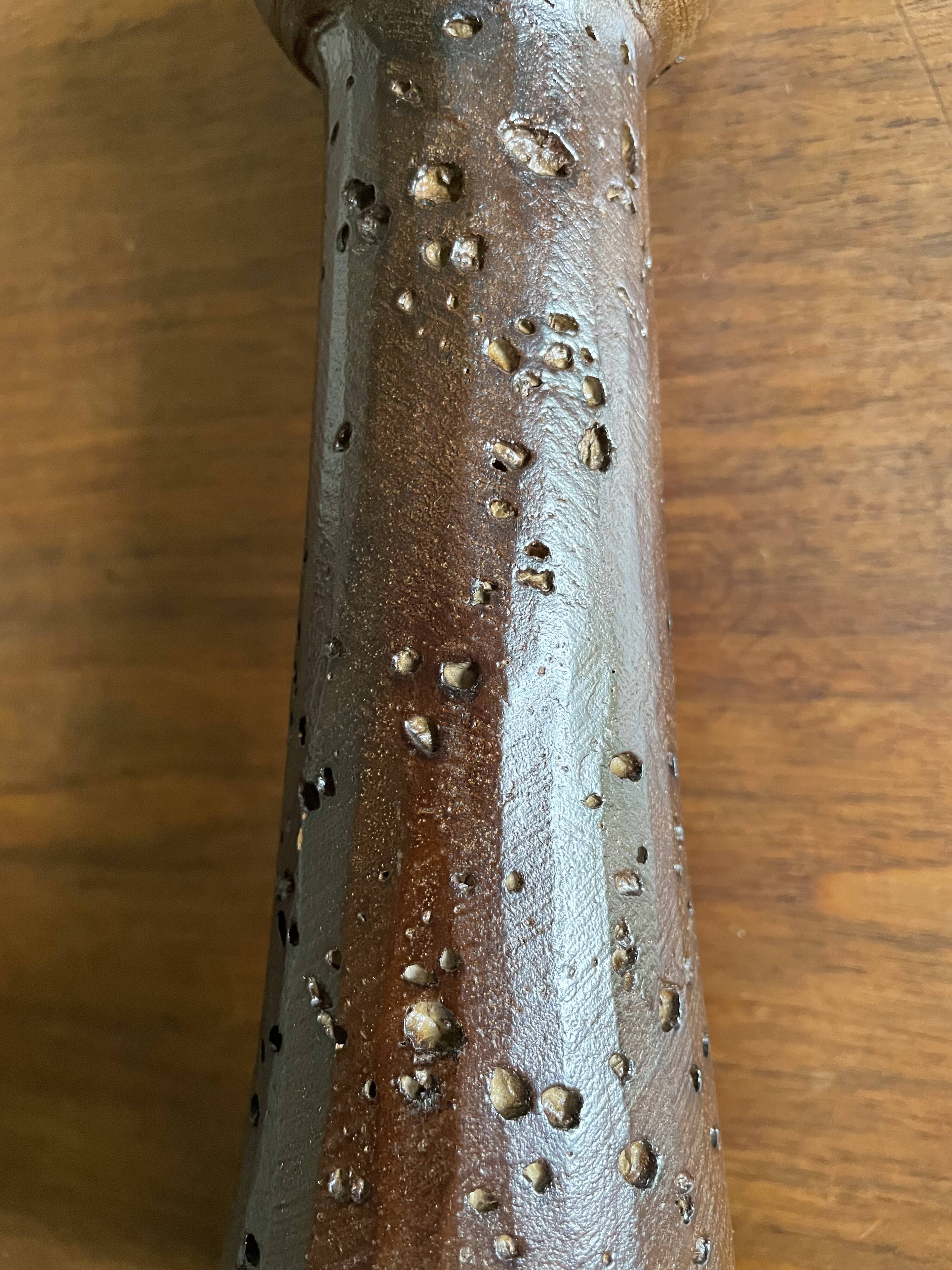 Brown enamelled terracotta candle holder