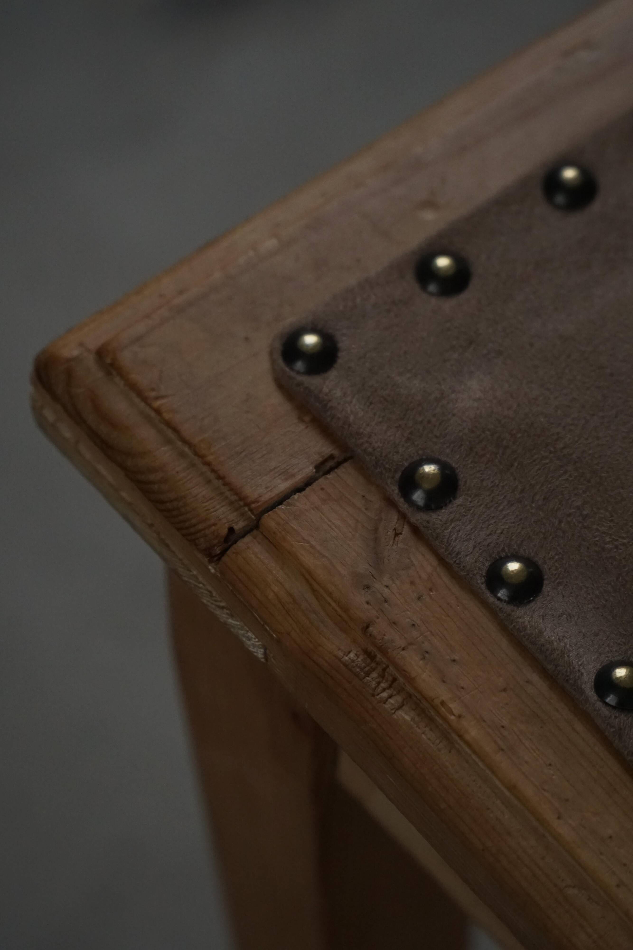 A pair of antique Danish pine stools from the late 19th century.