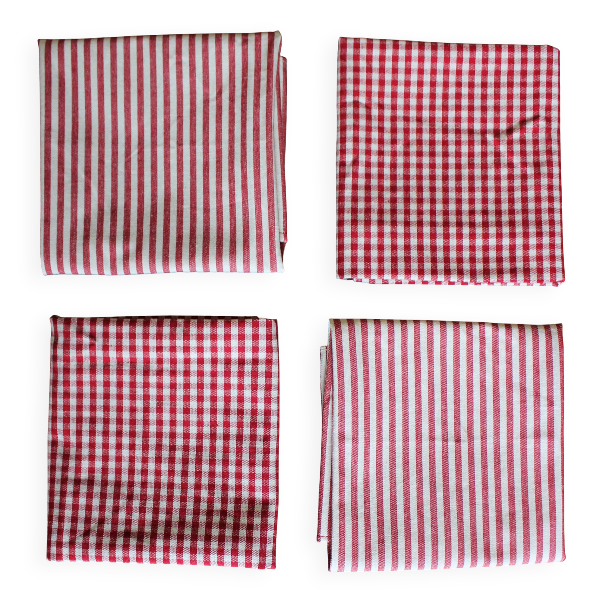 A set of 4 red striped and checkered napkins.