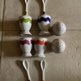 Set of 4 egg cups with their spoons, salt shaker, colored pepper shaker