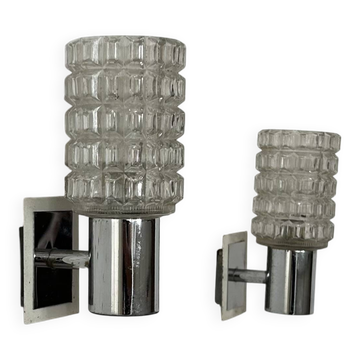 Pair of vintage wall lights, chromed metal and pressed molded glass, Italy, 1970