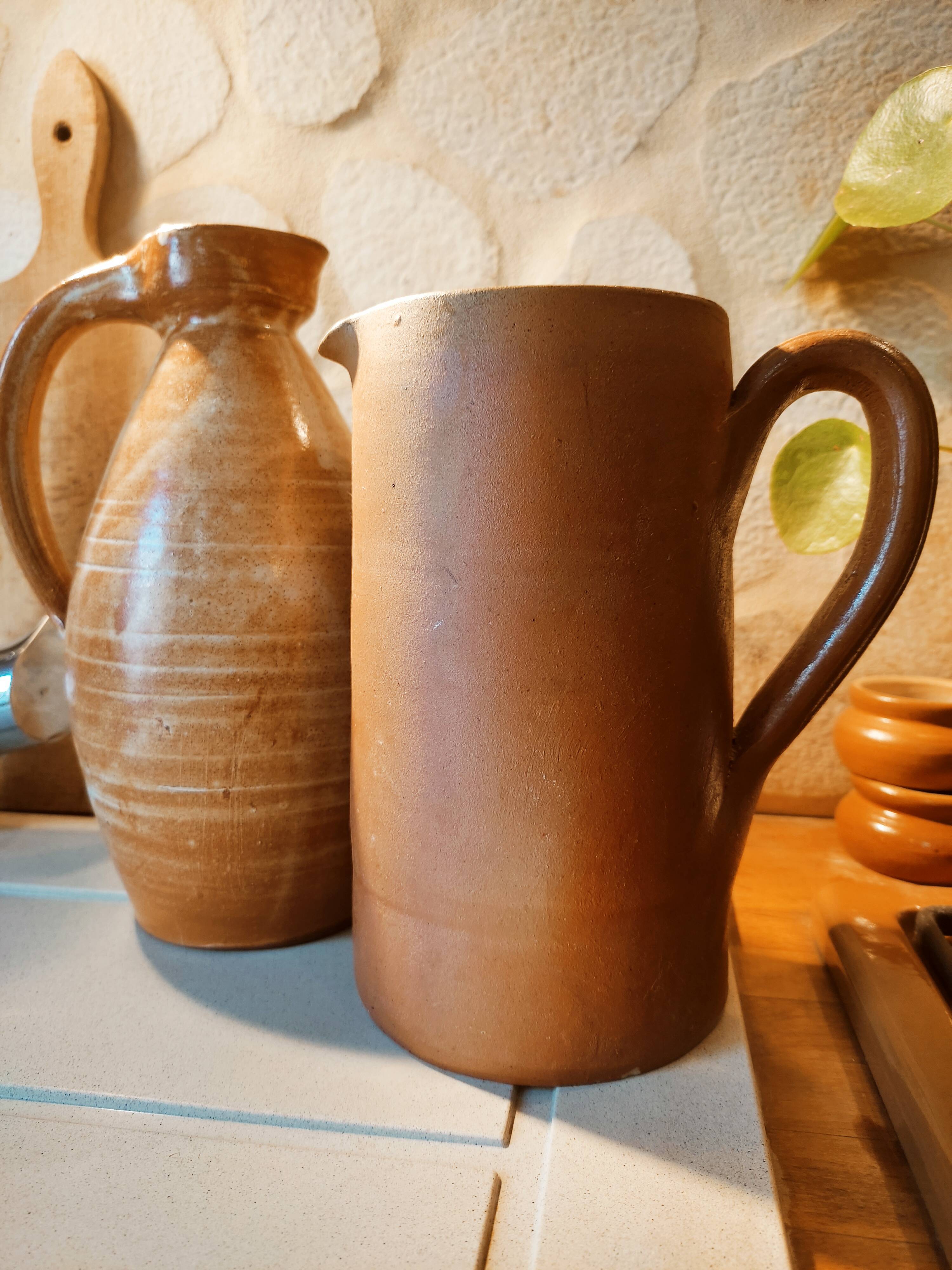 Duo of pitchers water, wine