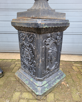 Large antique cast iron vases on pedestal
