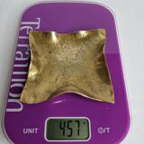 Empty pocket in polished brass representing a crumpled paper, signed CJ, 11.5 cm
