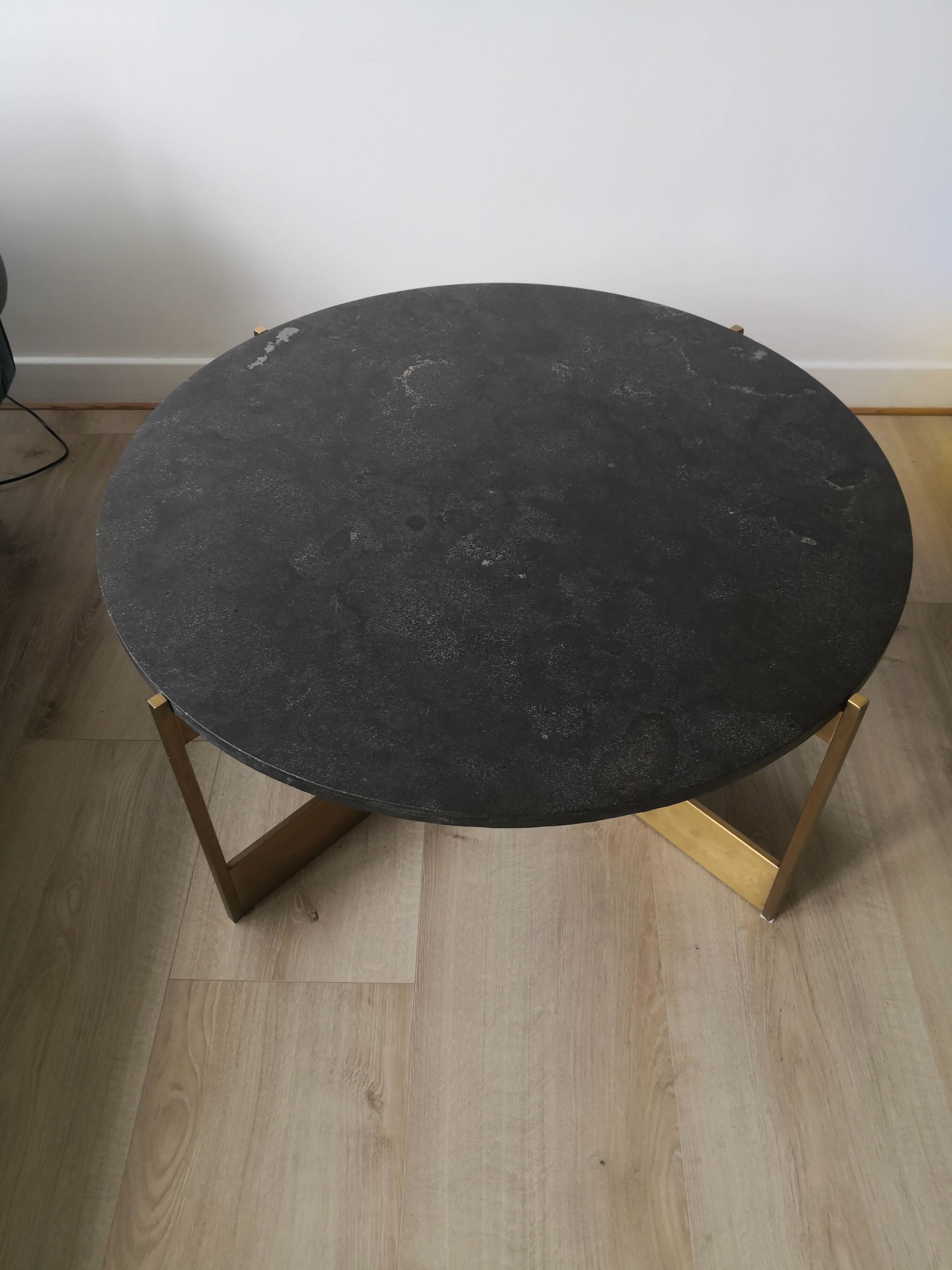 Round coffee table with a metal base and a blue stone top.