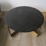 Round coffee table with a metal base and a blue stone top.