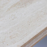 A vintage travertine coffee table