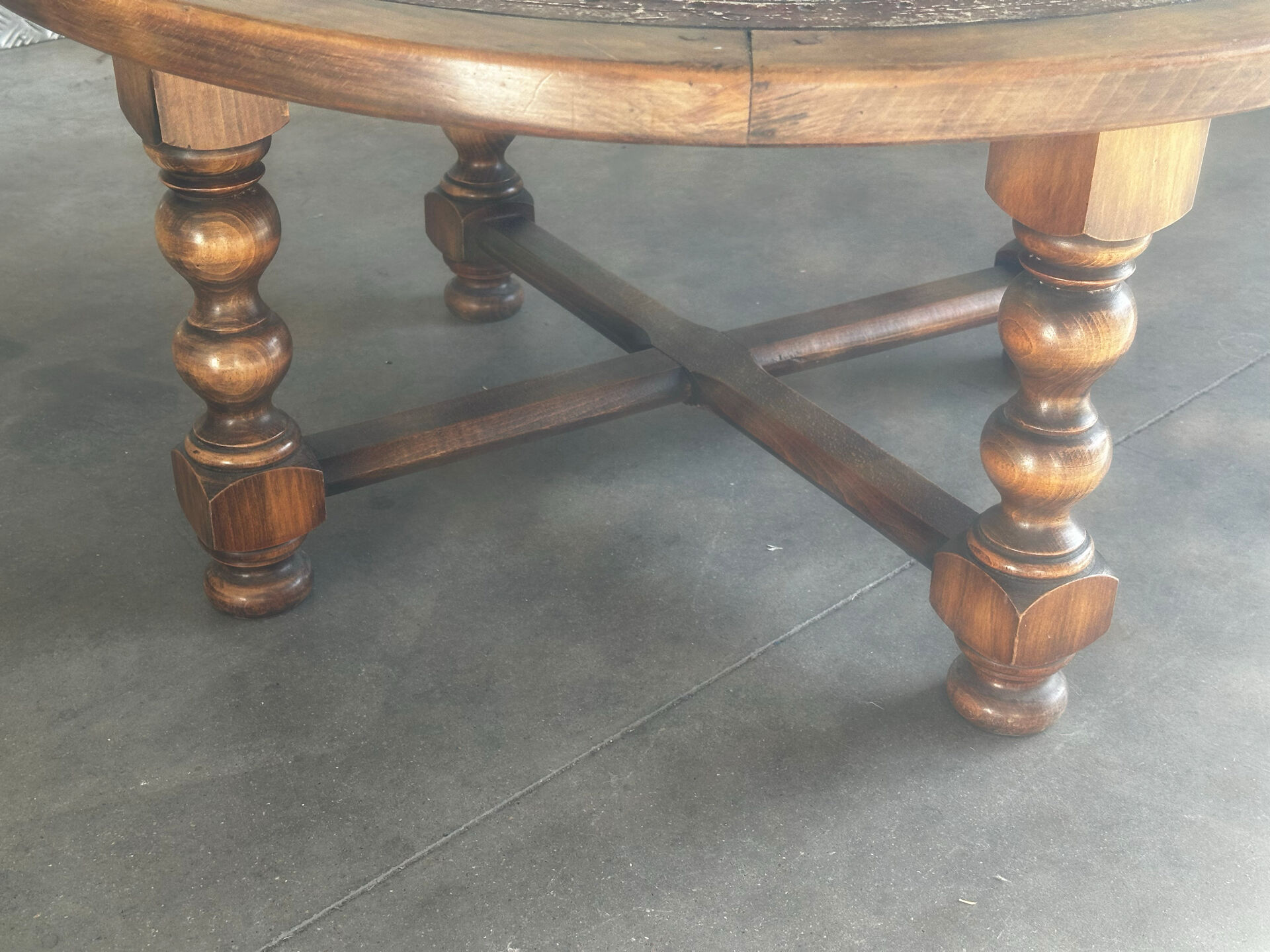 Vintage coffee table in turned wood and leather with astrological decoration.