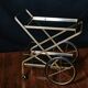 Vintage rolling trolley in gold metal & smoked glass – Retro elegance as
