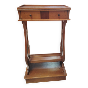 Vintage end table with lyre legs and two drawers.