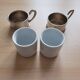2 porcelain coffee cups with cup holder and metal tray