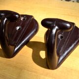 Pair of brown bakelite school hooks from 1957