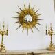 Massive gilded bronze chandeliers from the mid-20th century with marble bases.