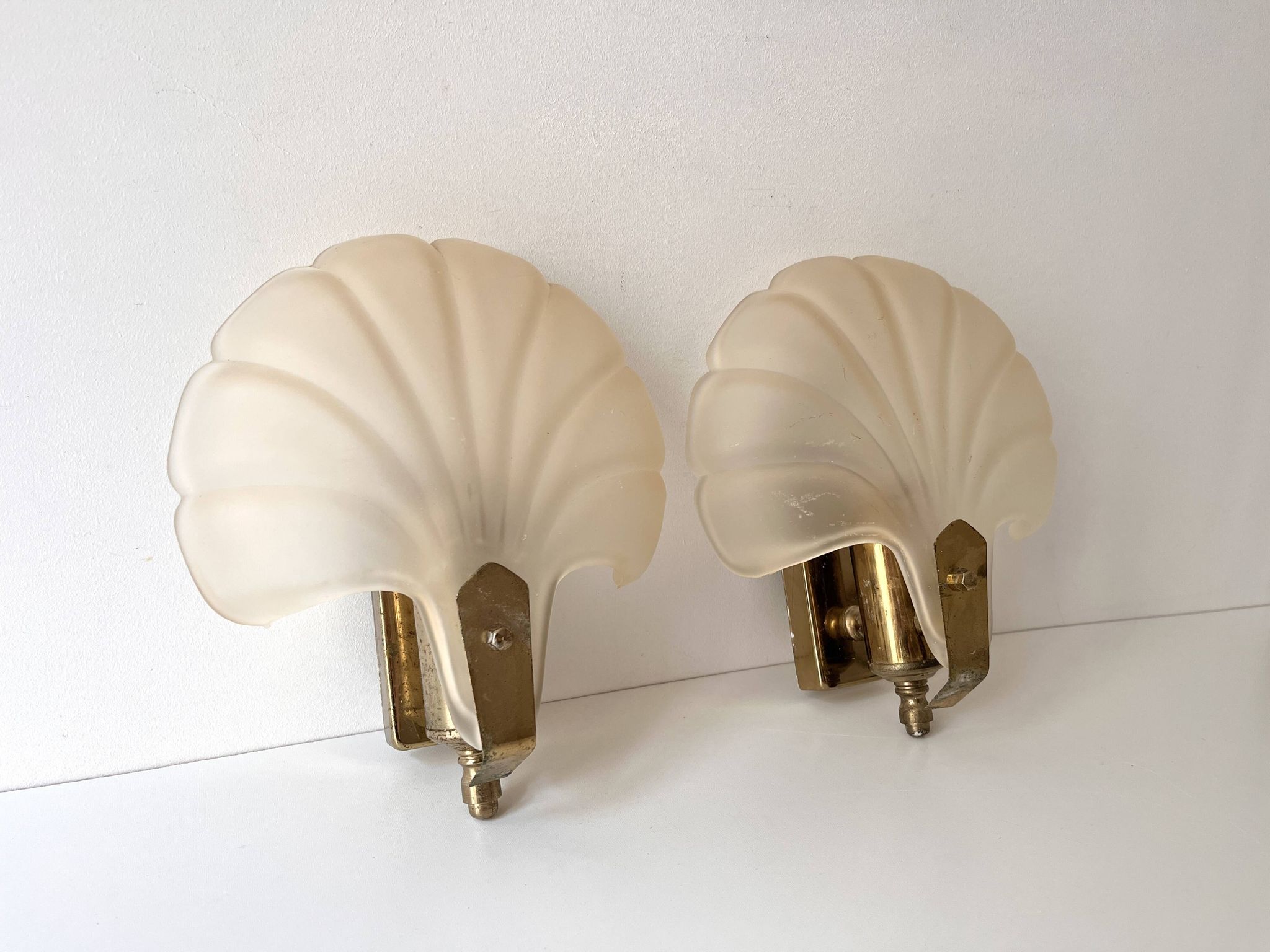Pair of vintage shell glass wall lights, Art Deco style fixtures.